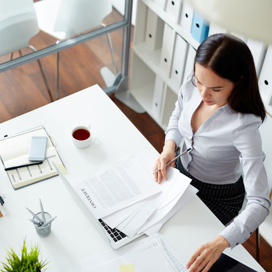 Woman getting documents together