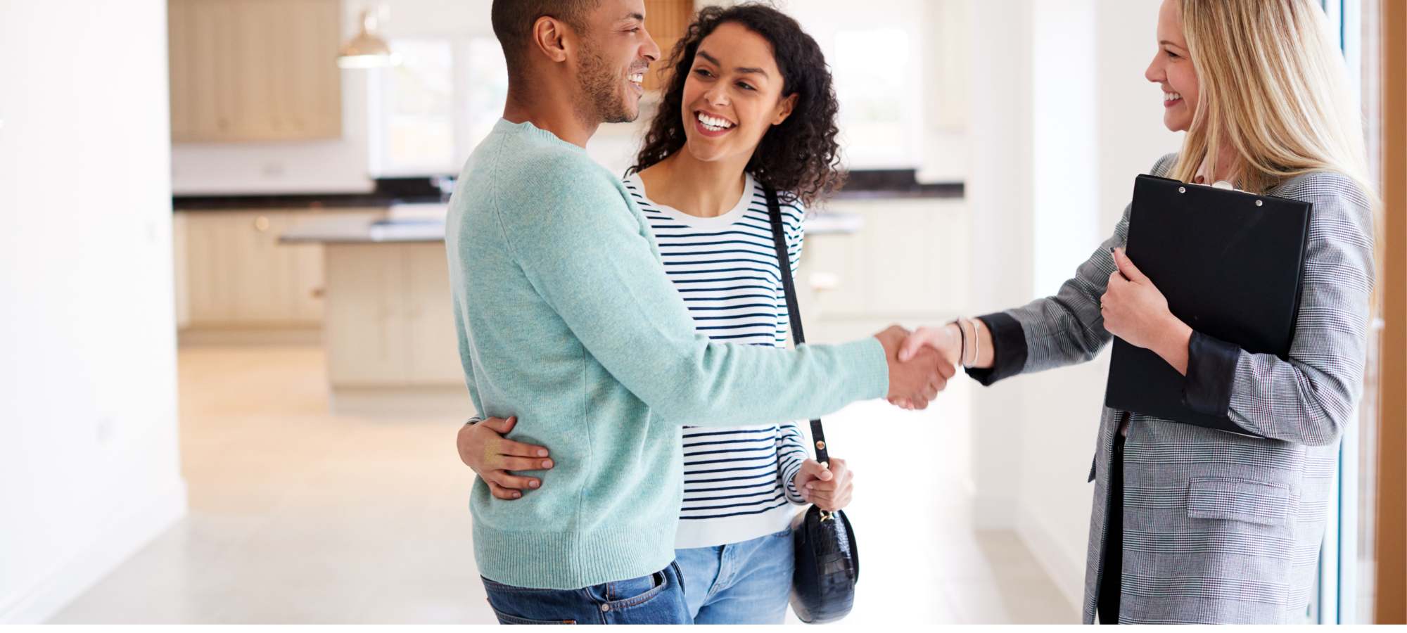 realtor shaking mans hand